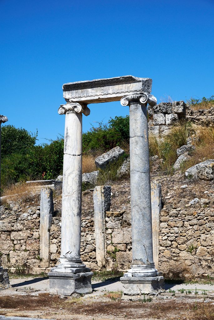 Survival through the ages in an earthquake prone zone of two column on the main street.